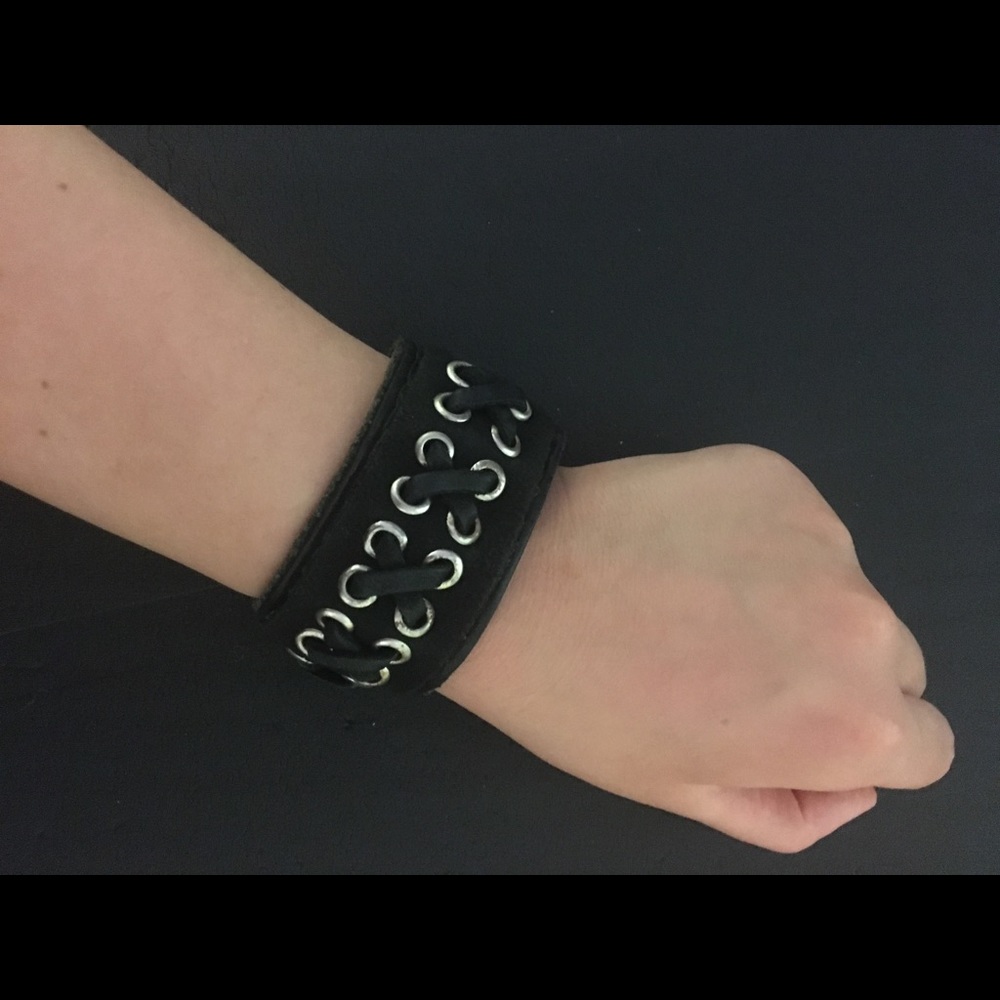 Leather cuff bracelet with hidden pocket. Lace up